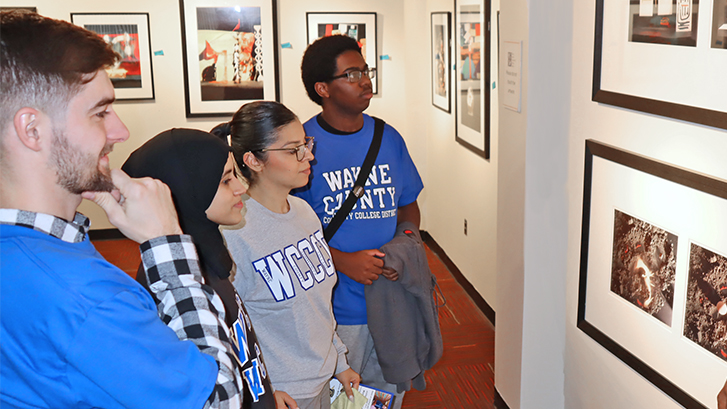 students viewing an art exhibit